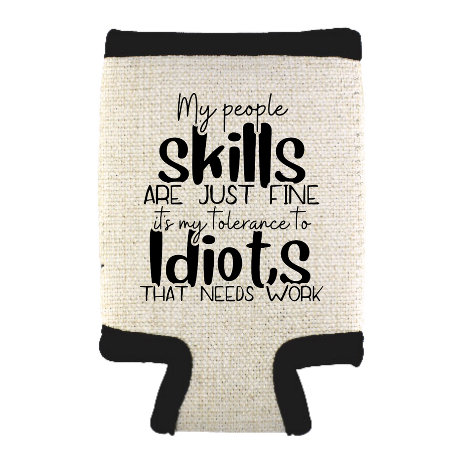 A beige can cooler with black text that reads: 'MY PEOPLE SKILLS ARE JUST FINE, IT'S MY TOLERANCE TO IDIOTS THAT NEEDS WORK'