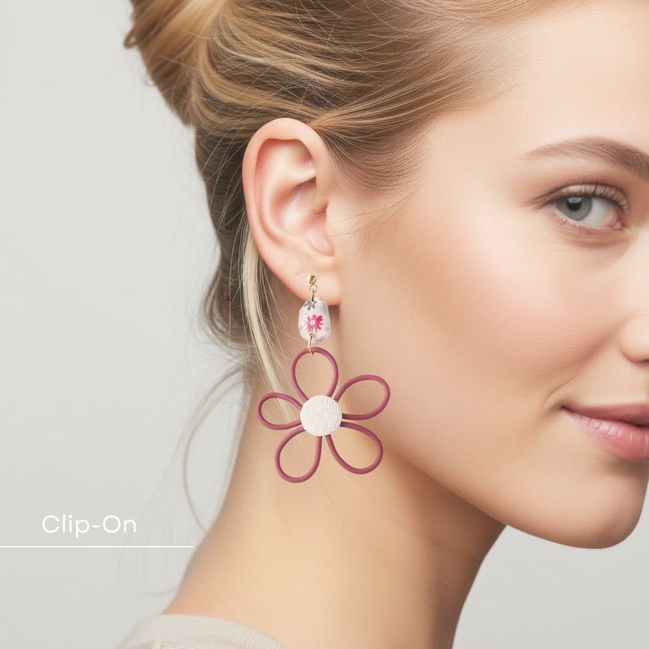 Woman wearing a floral earring with a plain background