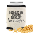 A beige can cooler with black text and trim, stating 'I Googled My Symptoms Turns Out I'm A Bitch', with peanuts visible in the foreground.