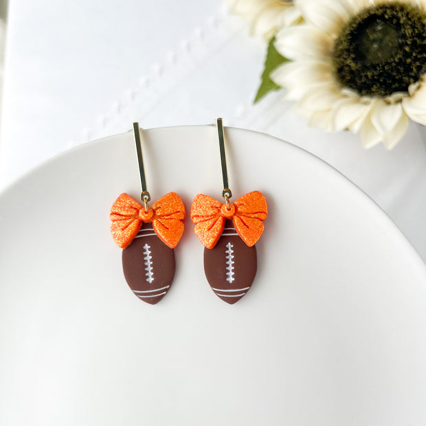 Football With Bow Lightweight Earrings | Sports Polymer Clay Jewelry | Whimsical Clip-On Earrings Option