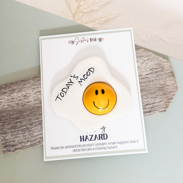 Handmade egg mood magnet with yellow bubbled happy face and Today's Mood text