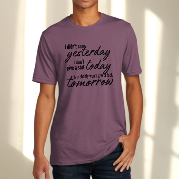 Person wearing a purple t-shirt with black text on a plain background