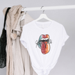 White t-shirt with colorful lips graphic and 'Wild Child' text on a hanger against a gray background.
