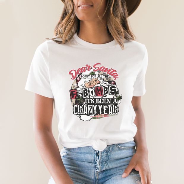 Person wearing a white t-shirt with a graphic design and text.